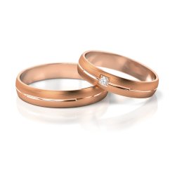 Souprava zlatých snubních prstenů s přírodním diamantem